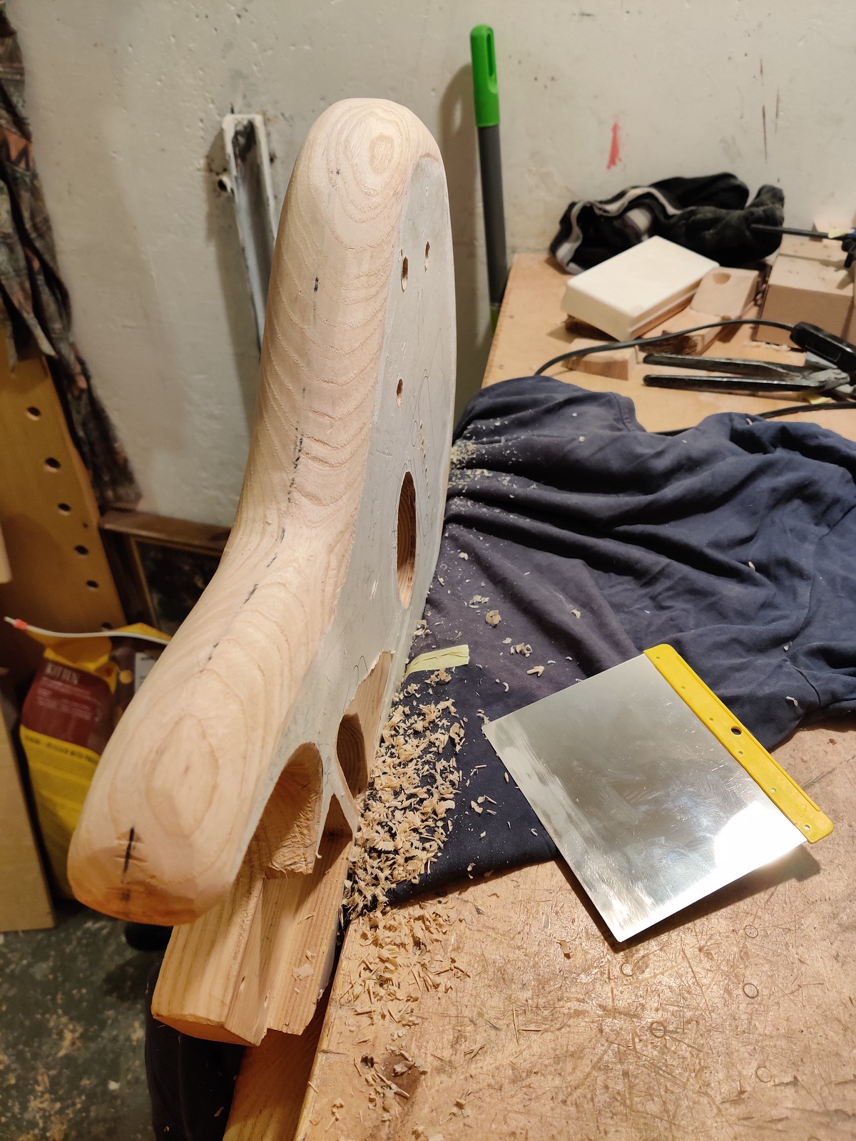 Guitar body and a makeshift scraper